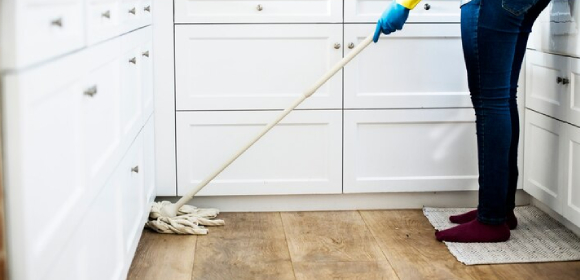 Excellent Cleaning 2 housekeeper in CT cleans kitchen floors.